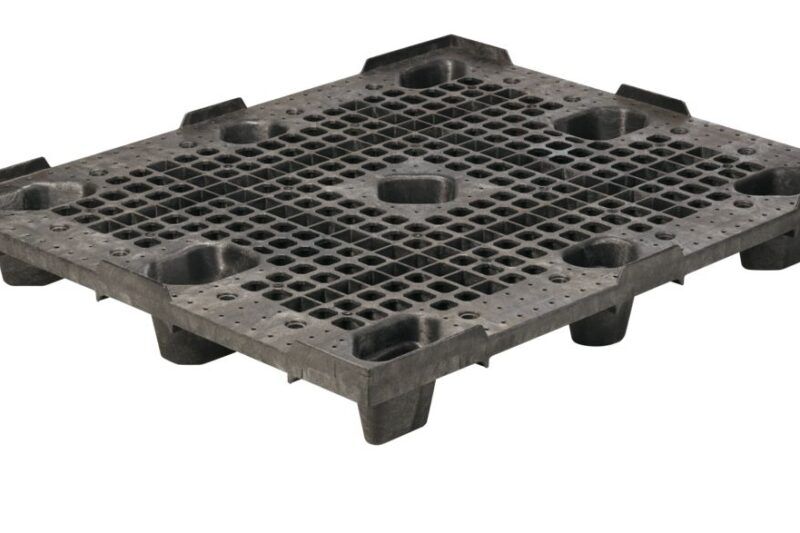 A black plastic grate with holes, resembling a plastic pallet.