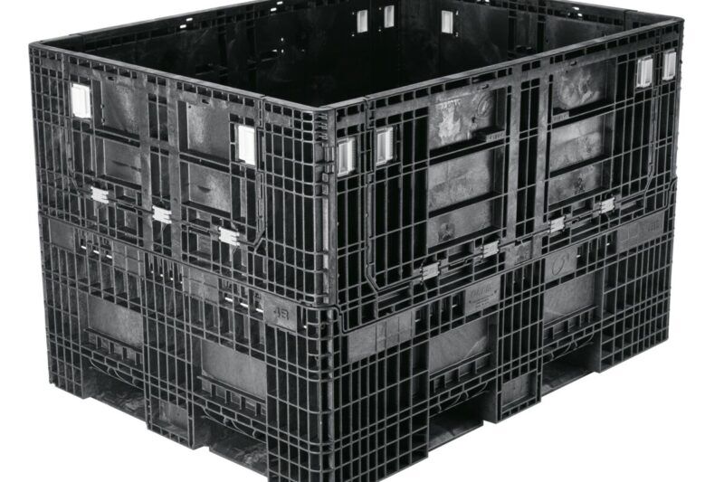 A collapsible black plastic bulk container on a white background.
