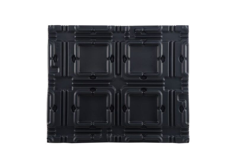 A black plastic panel on a white background.