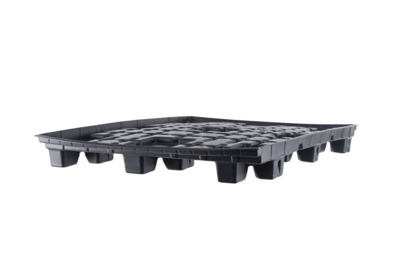 A black plastic pallet against a white background.