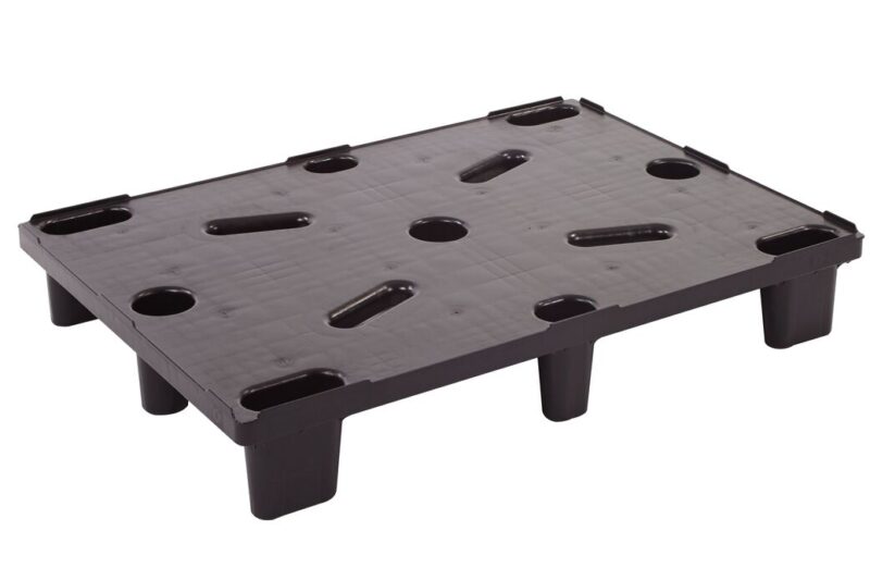 A black plastic pallet with holes.