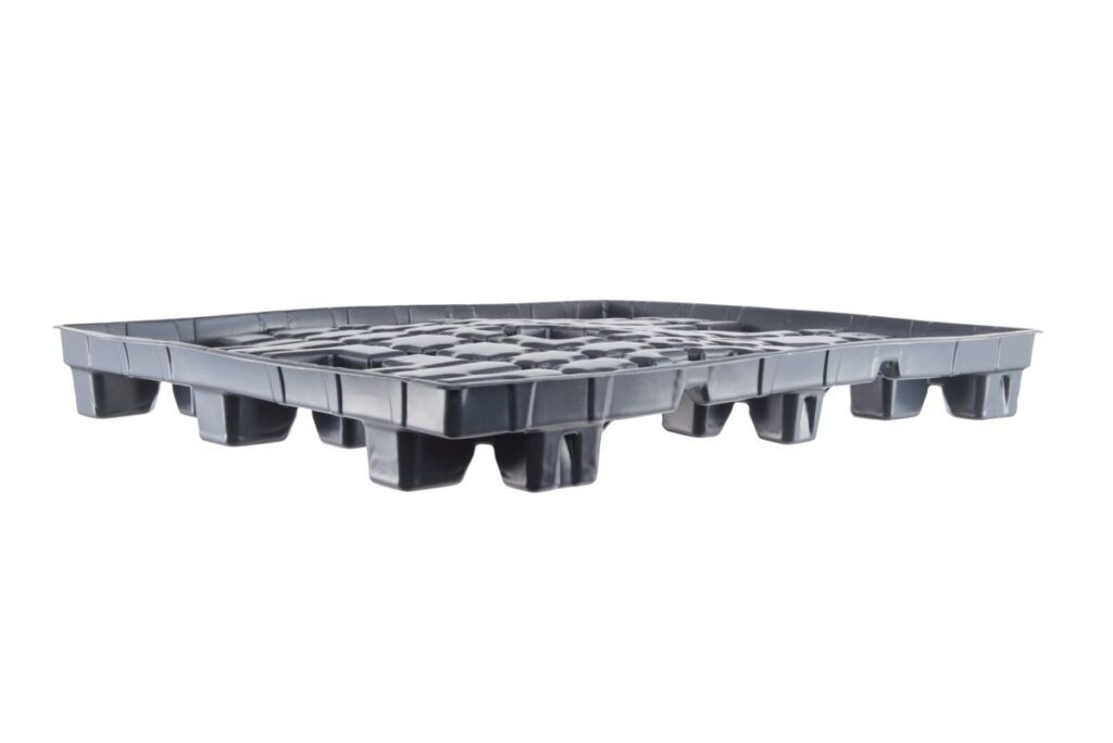 A plastic pallet with compartments.